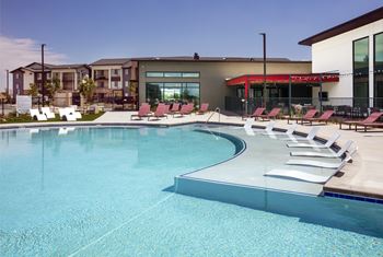 Resort style pool & spa deck with umbrellas